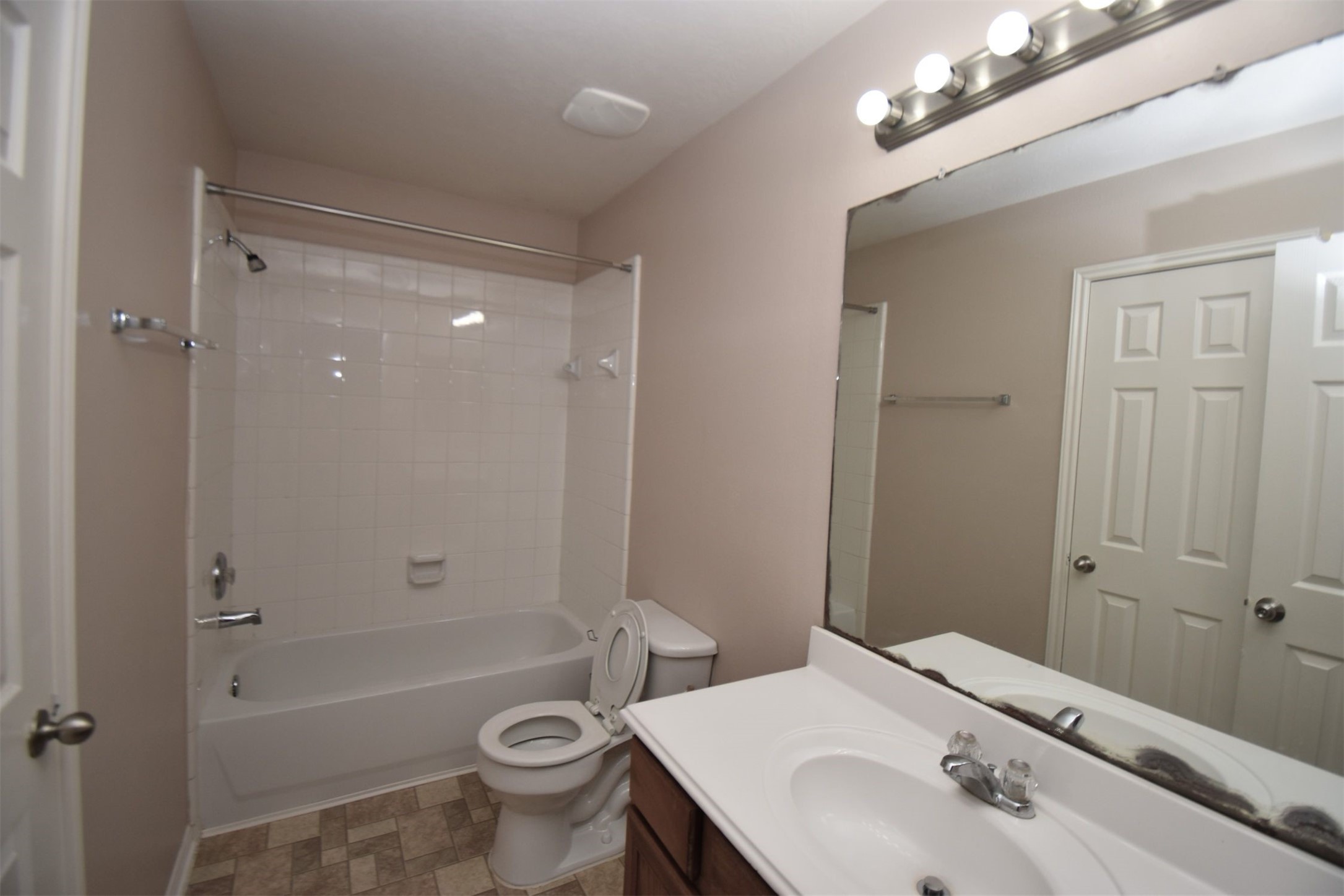 611 Chase More Court Bacliff, TX 77518 - Photo 12 of 20 a bathroom with a sink a toilet a mirror and shower