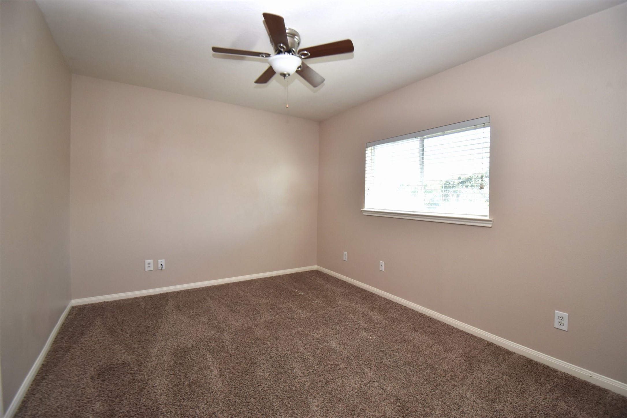 611 Chase More Court Bacliff, TX 77518 - Photo 13 of 20 an empty room with a window and a fan