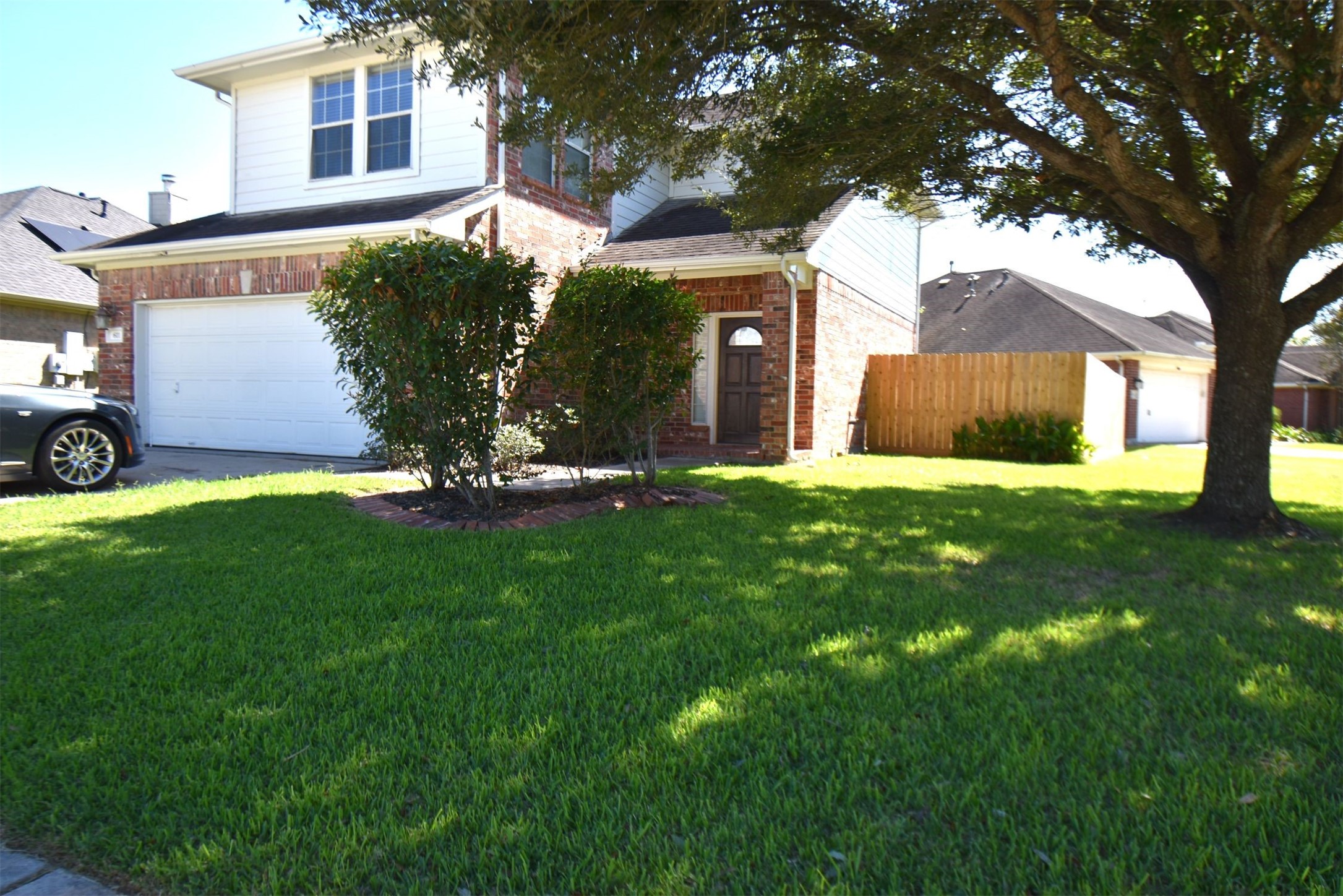 611 Chase More Court Bacliff, TX 77518 - Photo 19 of 20 a view of a yard in front of a house with large tree