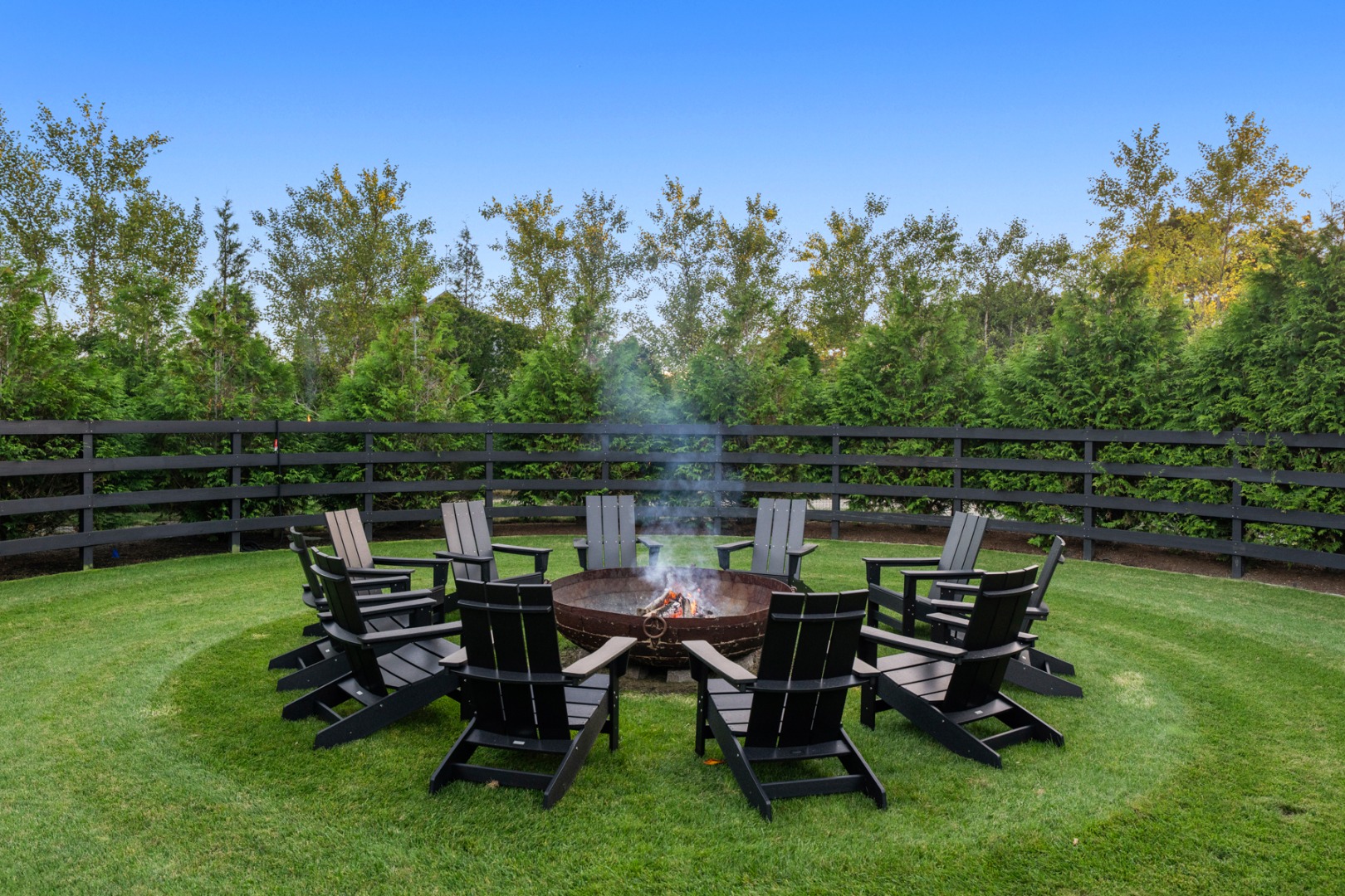 59 South Shore Road Nantucket, MA 02554 - Photo 15 of 54 a view of a backyard with chairs and a swing