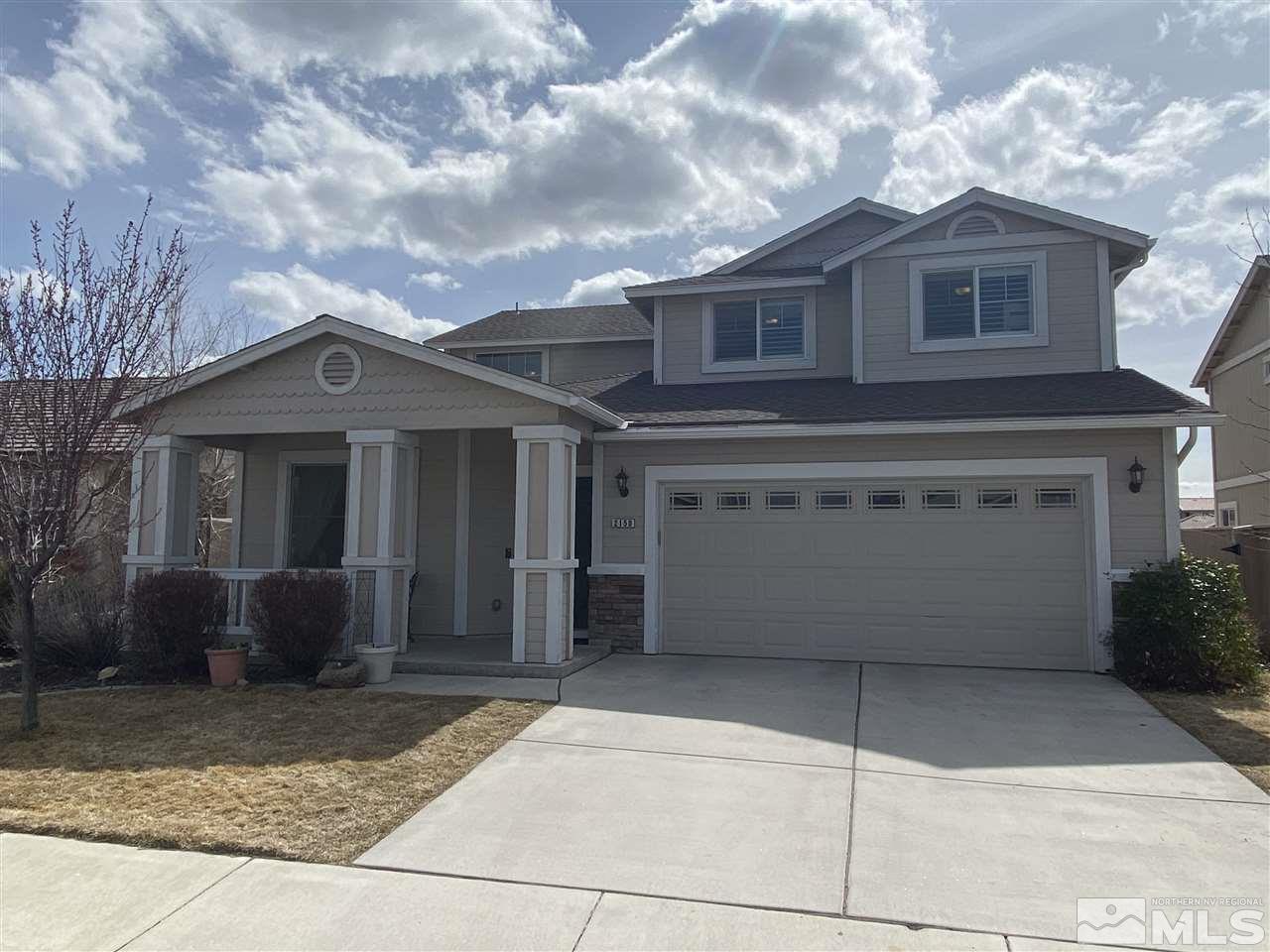 a front view of a house with a garage