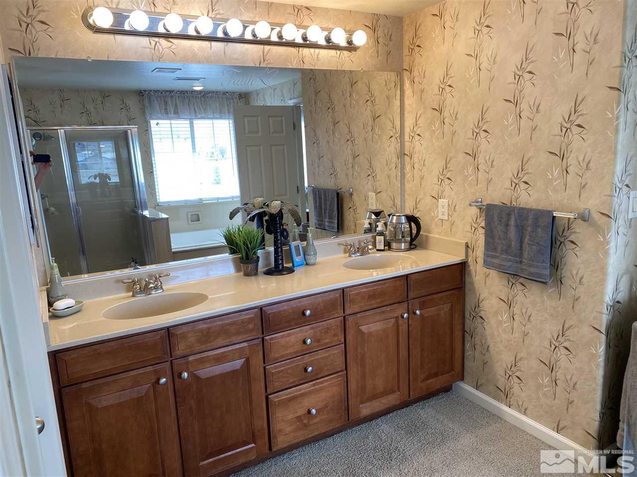 2150 Overland Road Reno, NV 89521 - Photo 11 of 19 a bathroom with a double vanity sink mirror and double