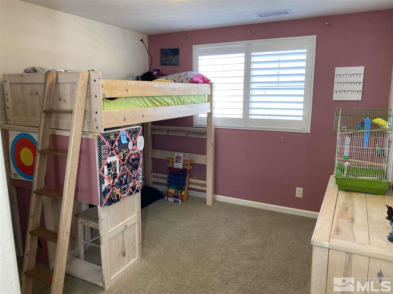 2150 Overland Road Reno, NV 89521 - Photo 15 of 19 a bedroom with a bed and a window