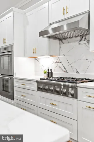 a large bathroom with a double vanity sink mirror and shower