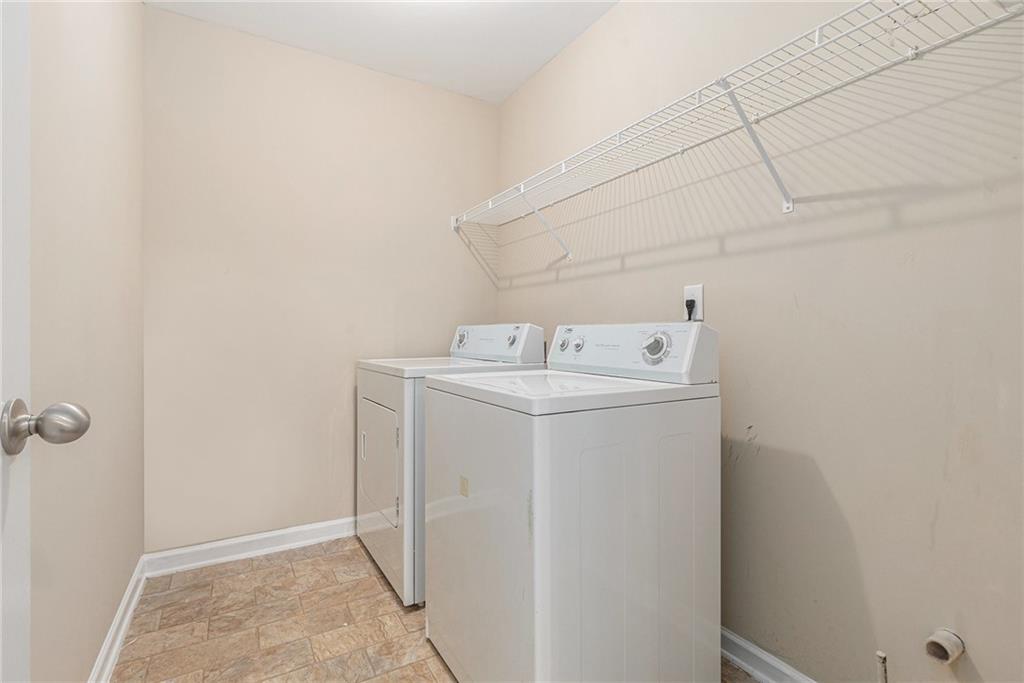 6054 Locklear Way Douglasville, GA 30134 - Photo 15 of 36 a utility room with dryer and washer