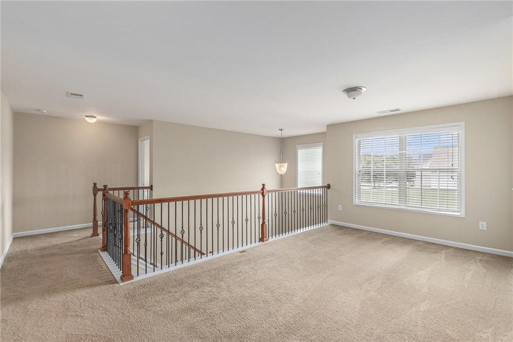 6054 Locklear Way Douglasville, GA 30134 - Photo 18 of 36 a view of an empty room with a window