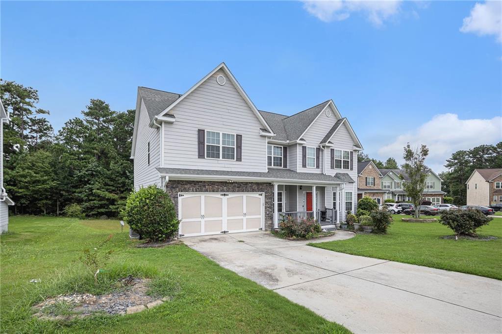 6054 Locklear Way Douglasville, GA 30134 - Photo 2 of 36 a front view of a house with a yard