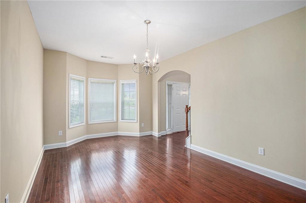 6054 Locklear Way Douglasville, GA 30134 - Photo 5 of 36 a view of a room with wooden floor and large window