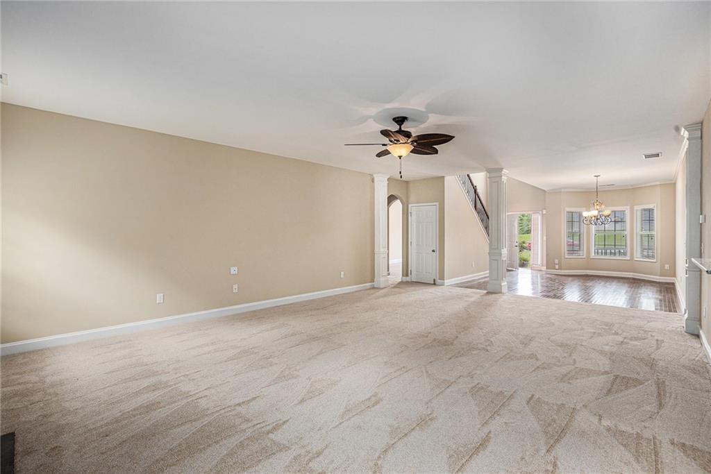 6054 Locklear Way Douglasville, GA 30134 - Photo 9 of 36 a view of an empty room with a chandelier