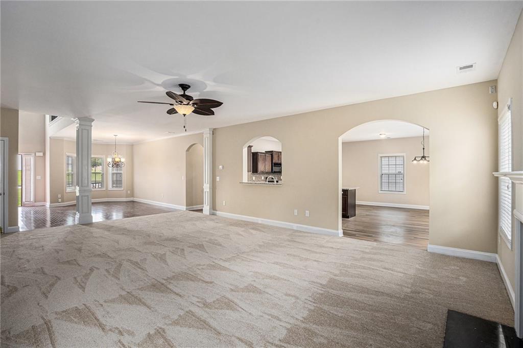 6054 Locklear Way Douglasville, GA 30134 - Photo 10 of 36 a view of an empty room with a ceiling fan and window