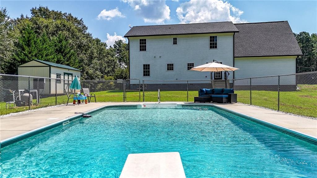 923 County Line Road Resaca, GA 30735 - Photo 11 of 49 a view of a house with pool and a yard