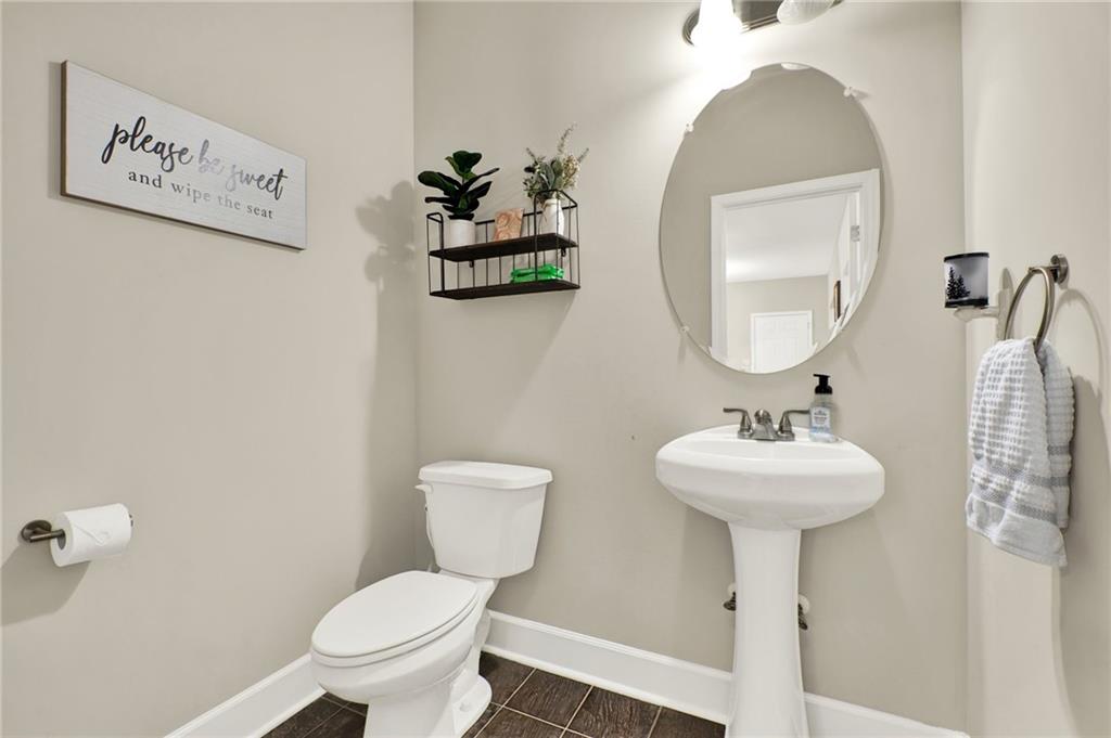 923 County Line Road Resaca, GA 30735 - Photo 22 of 49 a bathroom with a toilet sink and mirror