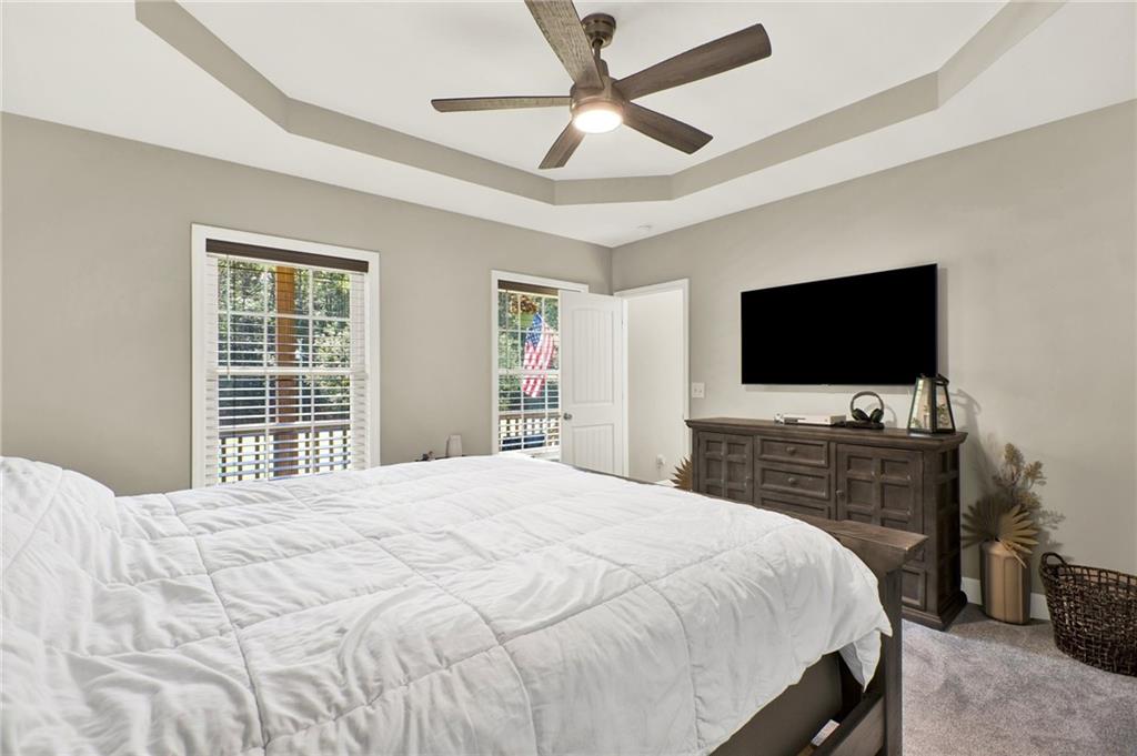 923 County Line Road Resaca, GA 30735 - Photo 25 of 49 a bedroom with a bed and a flat screen tv