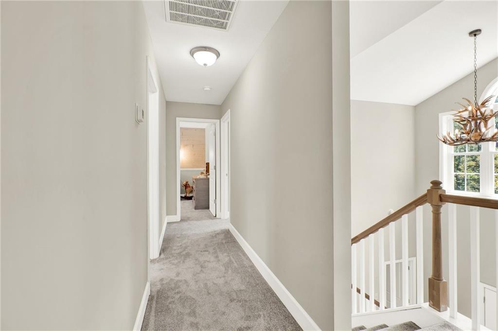 923 County Line Road Resaca, GA 30735 - Photo 30 of 49 a view of a hallway with wooden floor and a window