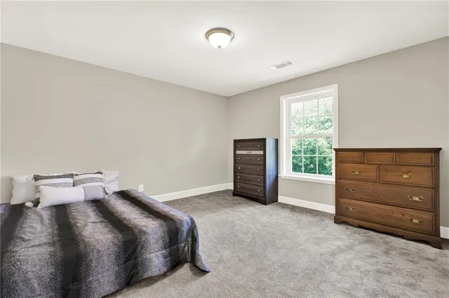 a view of room with cabinet and ceiling fan