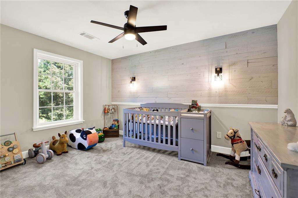 923 County Line Road Resaca, GA 30735 - Photo 33 of 49 a bed room with furniture and a window