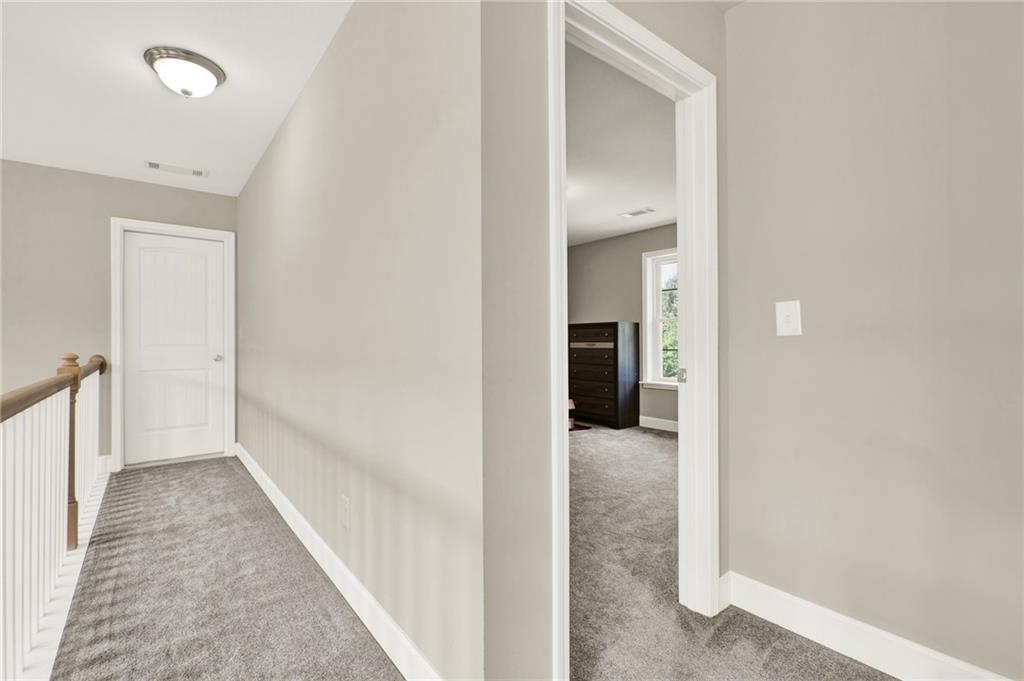 923 County Line Road Resaca, GA 30735 - Photo 35 of 49 a view of a hallway with wooden shelves