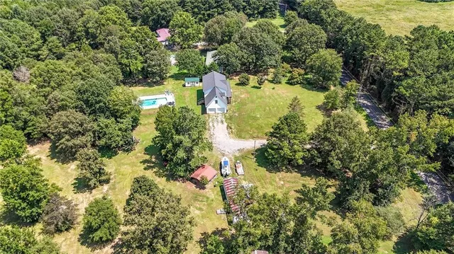 a view of a backyard with a sitting area