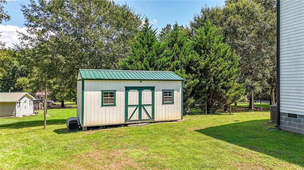 923 County Line Road Resaca, GA 30735 - Photo 43 of 49 a view of a house with a yard