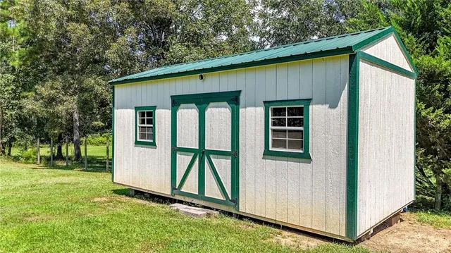a view of swimming pool with a yard