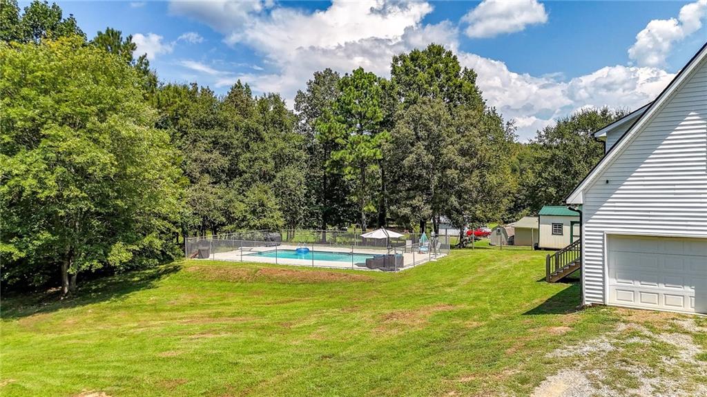 923 County Line Road Resaca, GA 30735 - Photo 7 of 49 a view of a swimming pool with a yard