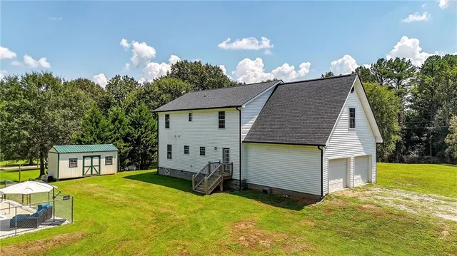a view of a backyard with a small pool