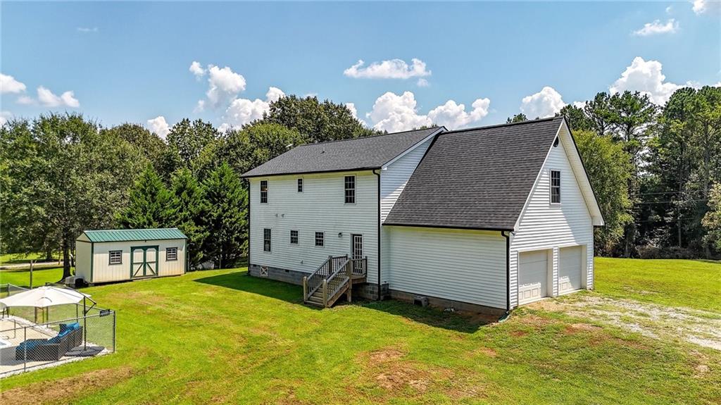 923 County Line Road Resaca, GA 30735 - Photo 8 of 49 a view of a house with backyard and a garden