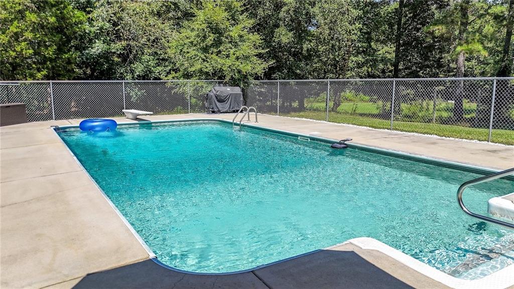 923 County Line Road Resaca, GA 30735 - Photo 9 of 49 a view of a backyard with a small pool