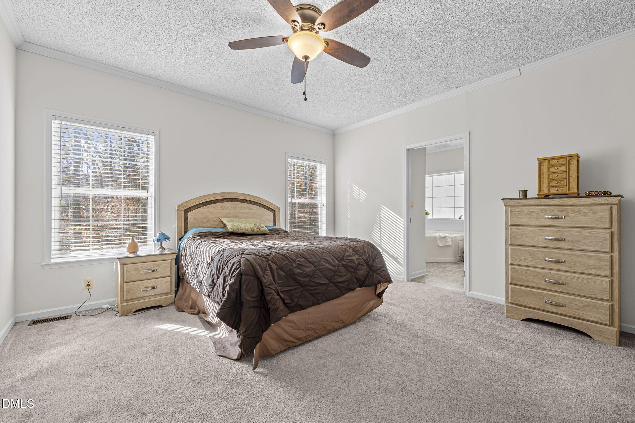 4501 Foreys Court Graham, NC 27253 - Photo 15 of 47 a spacious bedroom with a bed and a dresser