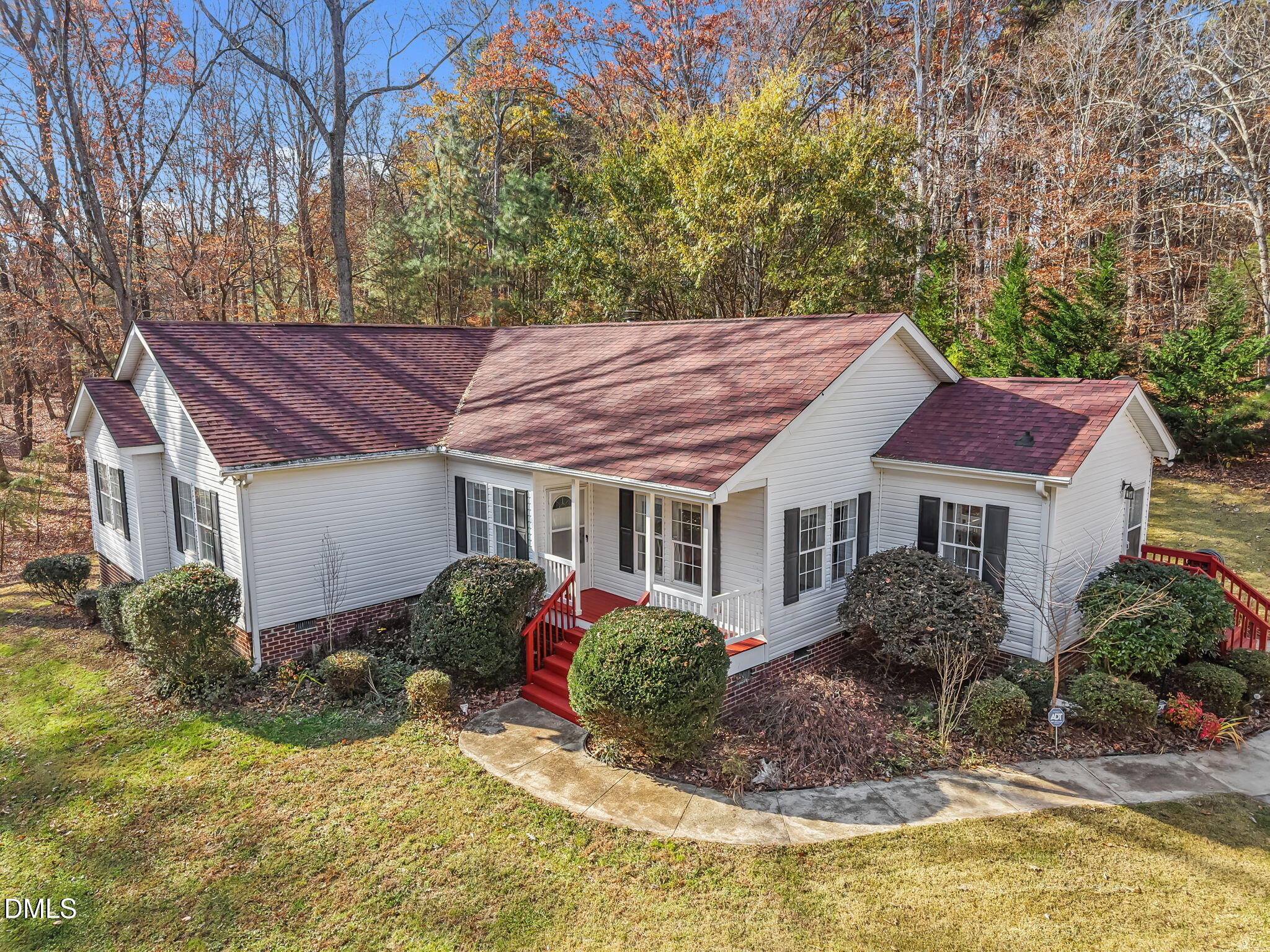 4501 Foreys Court Graham, NC 27253 - Photo 33 of 47 a view of a house with a yard chairs and floor to ceiling window
