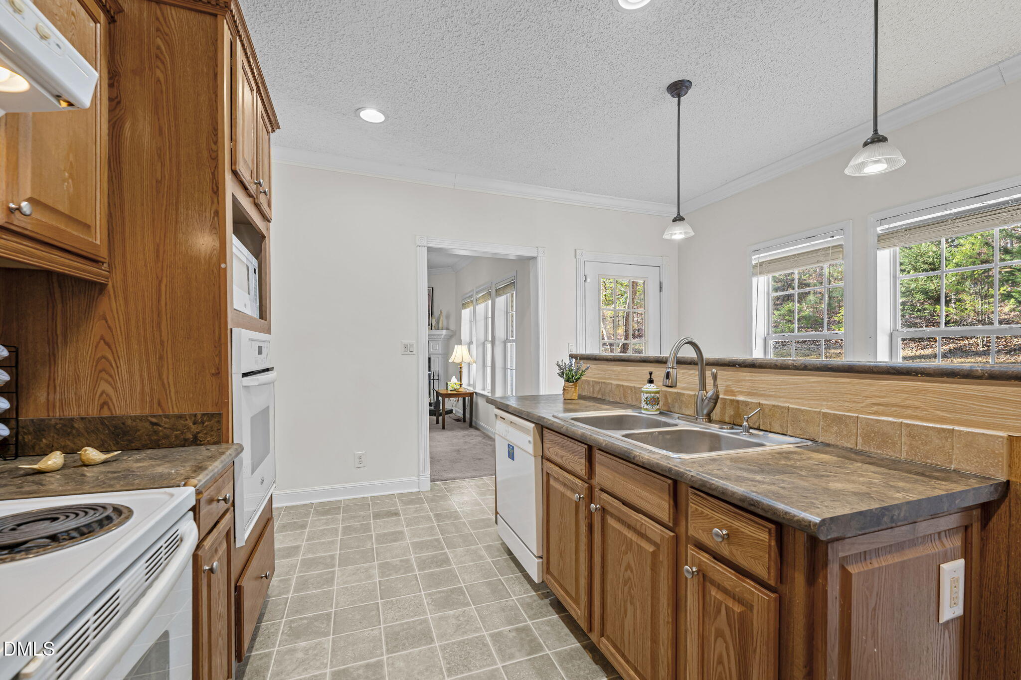 4501 Foreys Court Graham, NC 27253 - Photo 8 of 47 a kitchen with a sink stove and cabinets