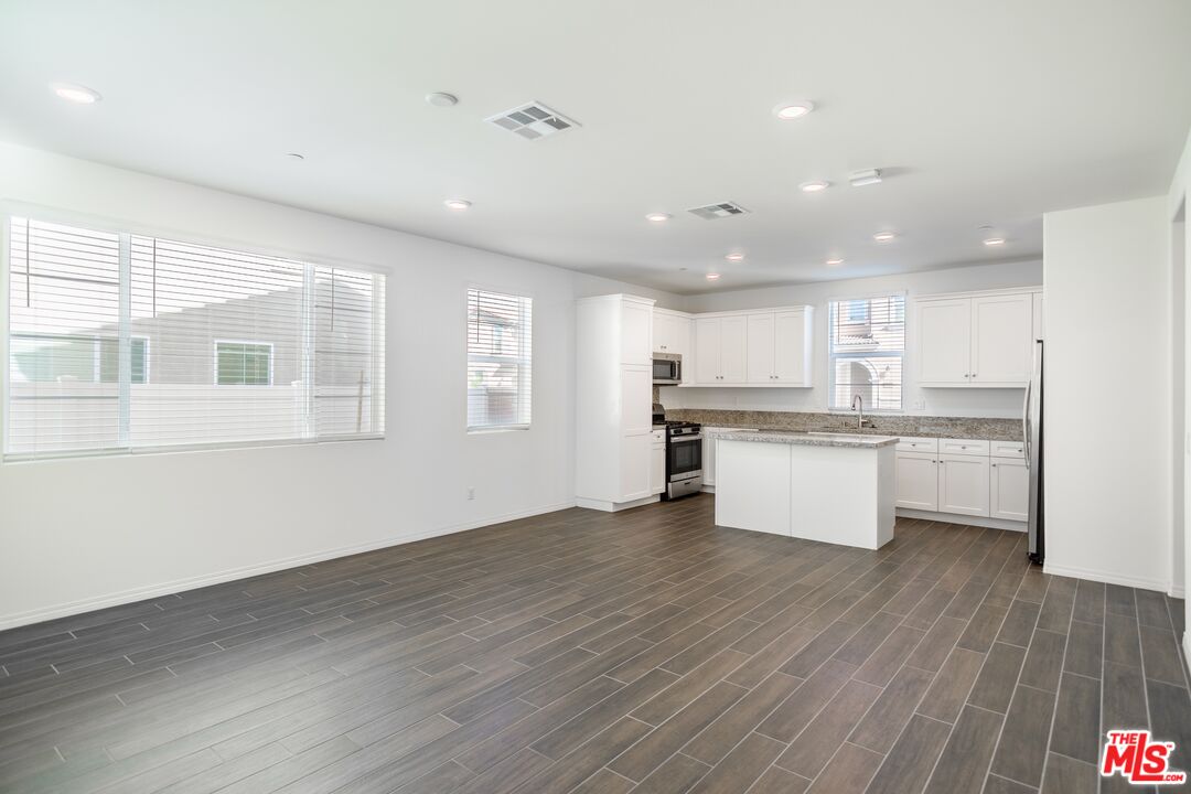 7935 Cold Creek Street Riverside, CA 92507 - Photo 12 of 45 a view of kitchen with wooden floor
