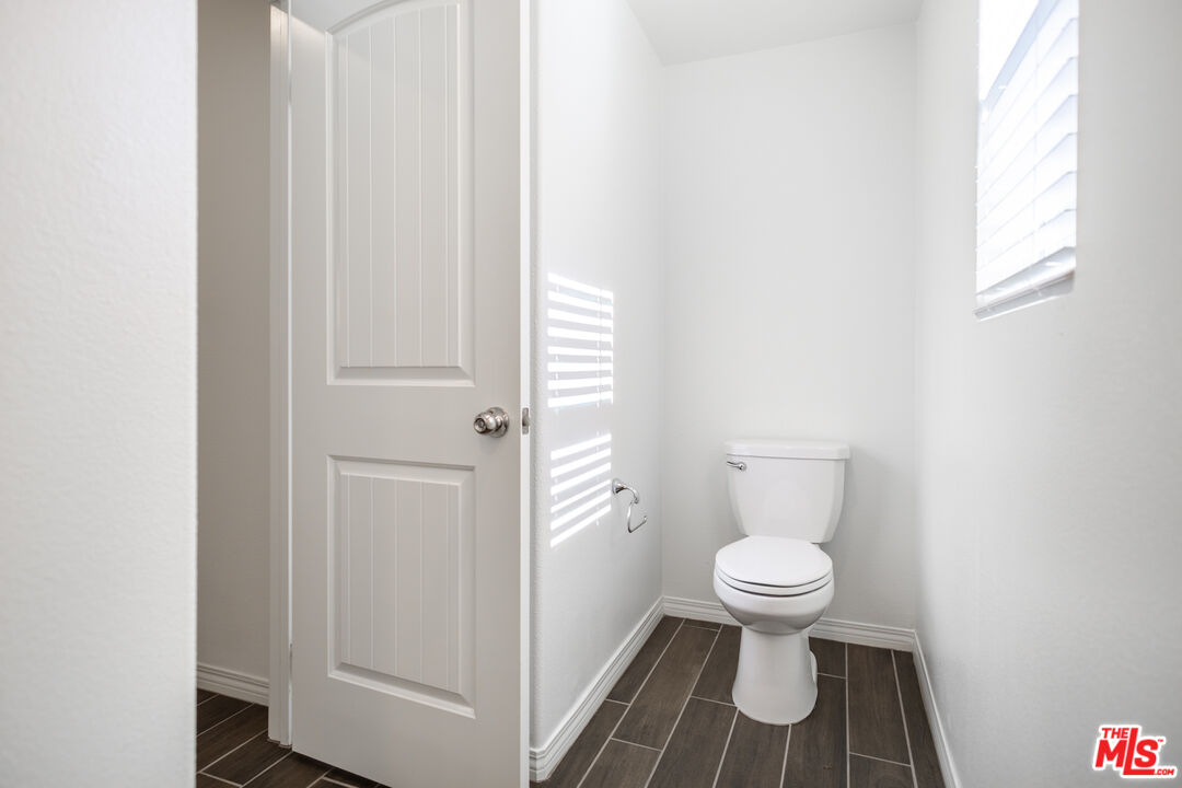 7935 Cold Creek Street Riverside, CA 92507 - Photo 17 of 45 a bathroom with a toilet and a shower