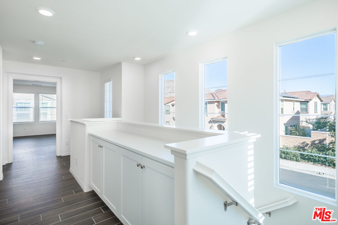 7935 Cold Creek Street Riverside, CA 92507 - Photo 18 of 45 a view of a kitchen island wooden floor and windows