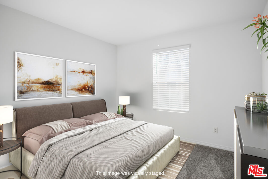 7935 Cold Creek Street Riverside, CA 92507 - Photo 24 of 45 a bedroom with a bed and a painting on the wall