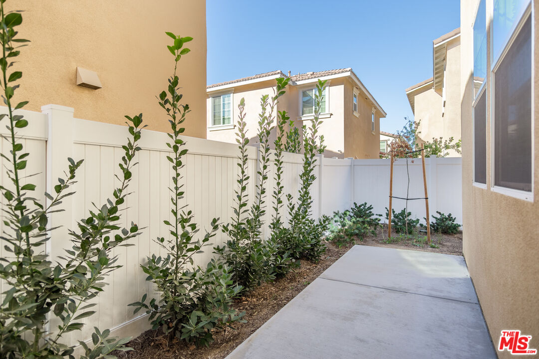 7935 Cold Creek Street Riverside, CA 92507 - Photo 43 of 45 a view of a house with a yard
