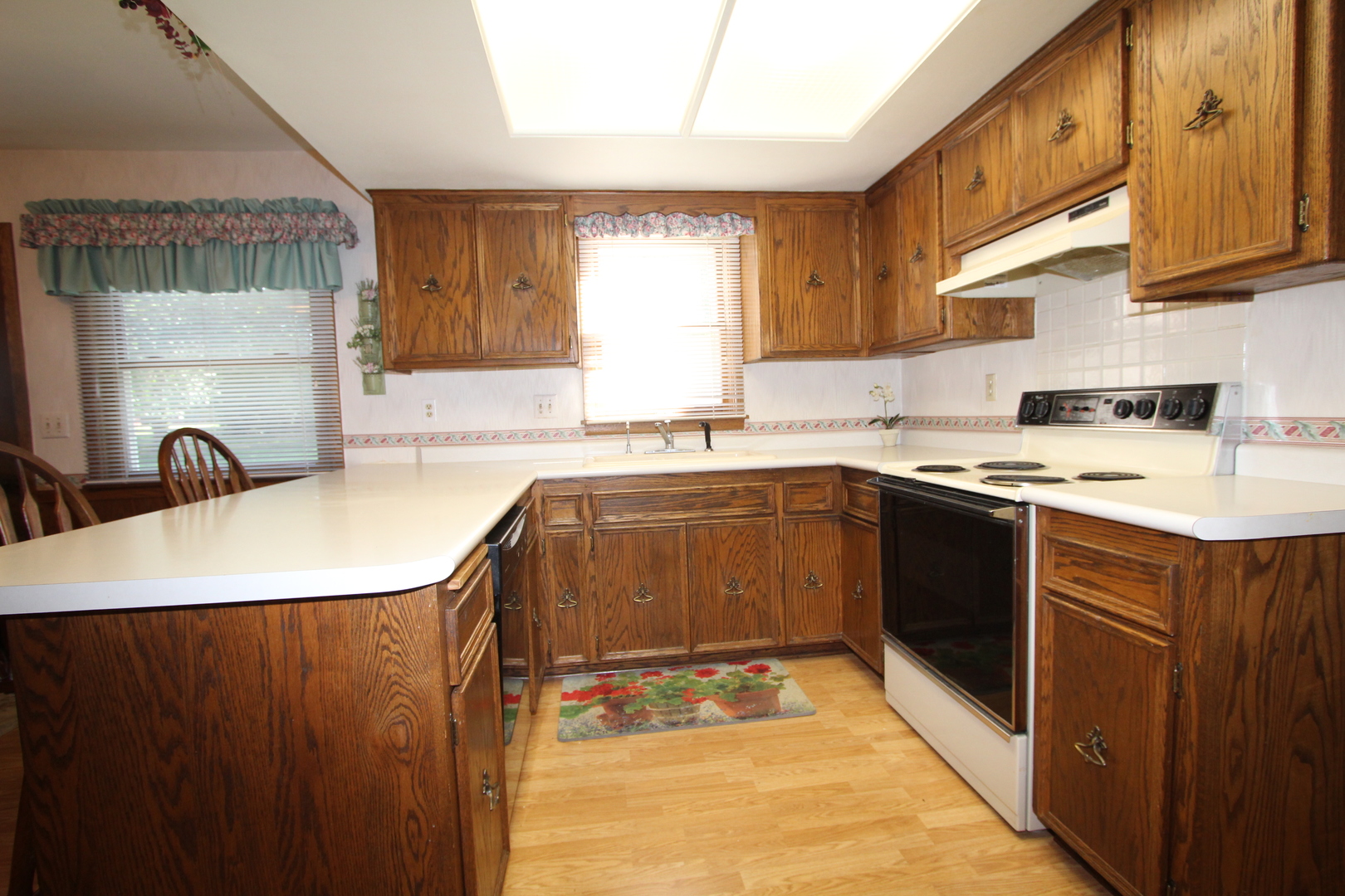 603 Old Orchard Road Harvard, IL 60033 - Photo 2 of 46 a kitchen with stainless steel appliances granite countertop a sink stove and refrigerator