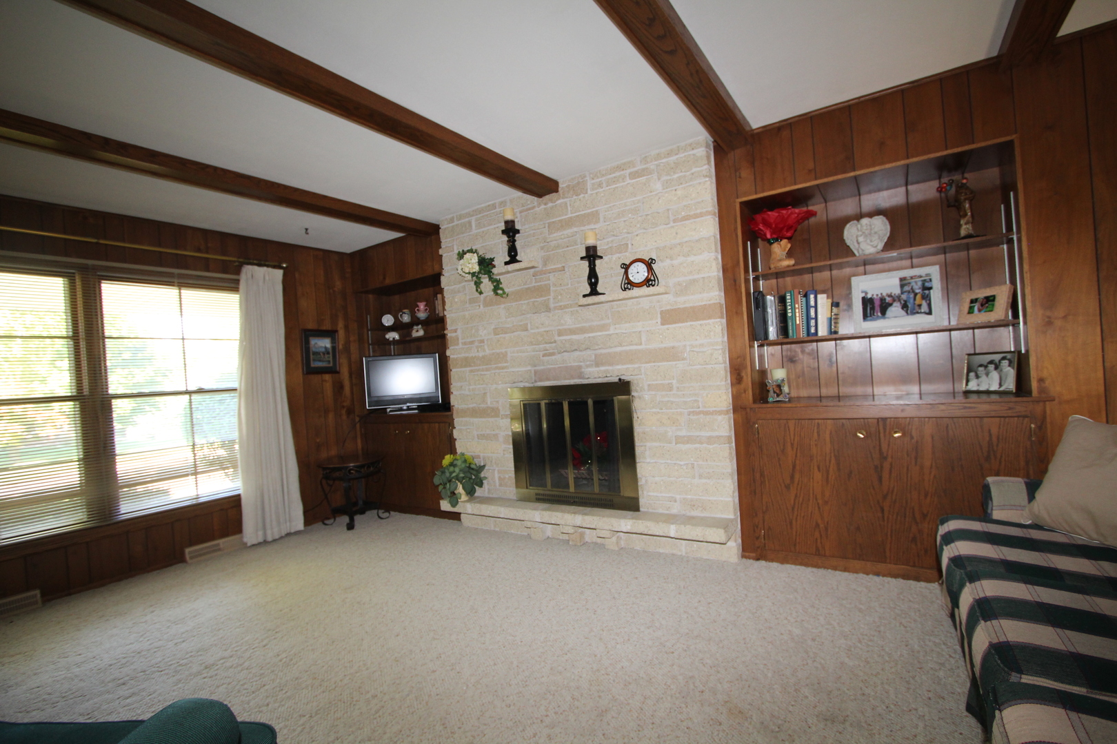603 Old Orchard Road Harvard, IL 60033 - Photo 15 of 46 a view of a livingroom with furniture and a fireplace