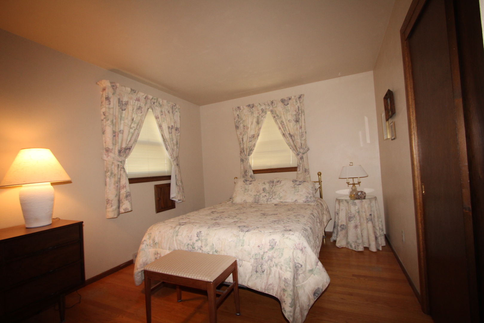 603 Old Orchard Road Harvard, IL 60033 - Photo 24 of 46 a bedroom with a bed and a lamp on table