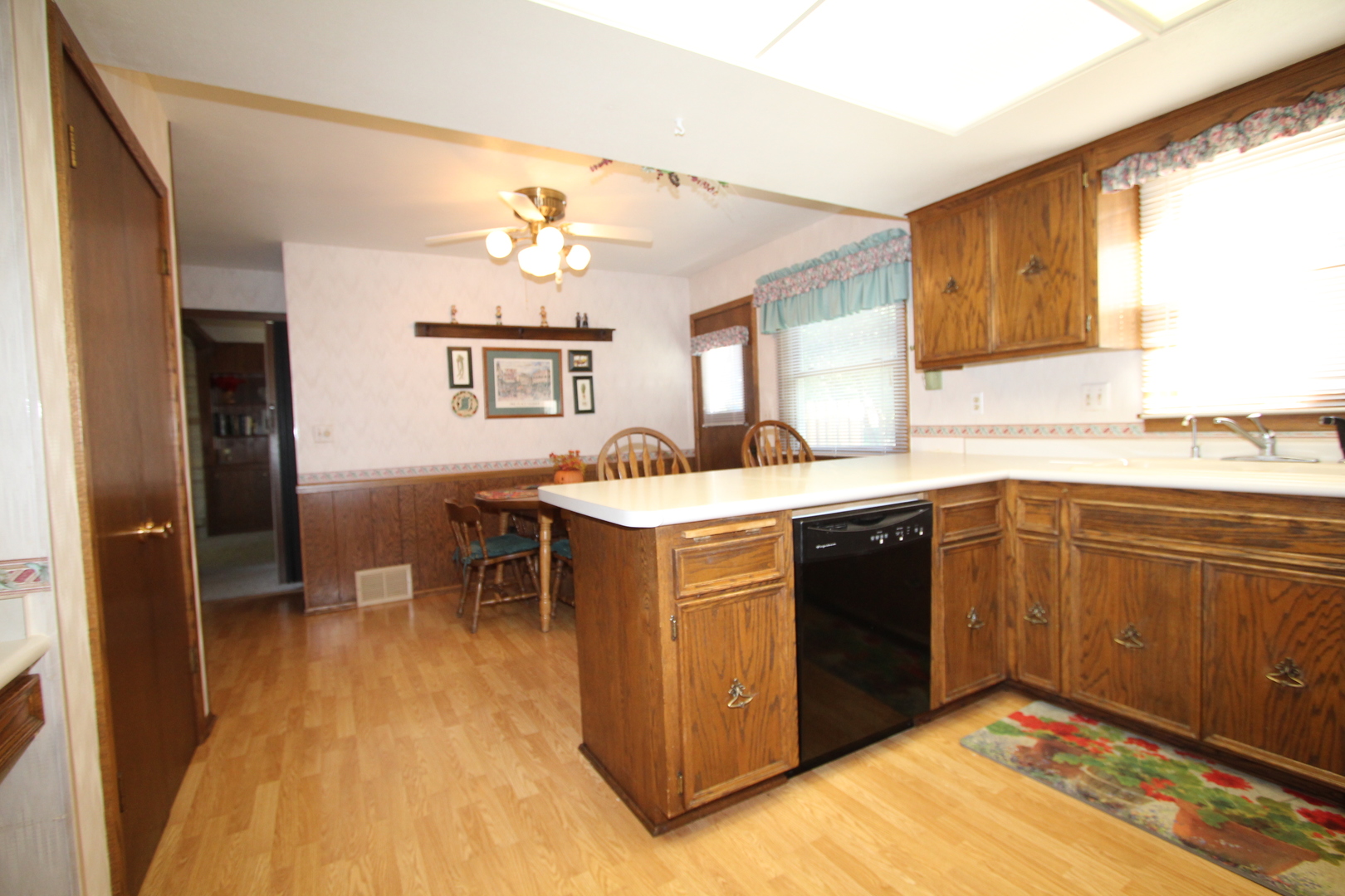 603 Old Orchard Road Harvard, IL 60033 - Photo 4 of 46 a kitchen with a stove sink and cabinets