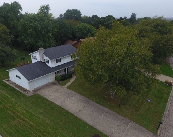 603 Old Orchard Road Harvard, IL 60033 - Photo 35 of 46 a view of a house with a yard