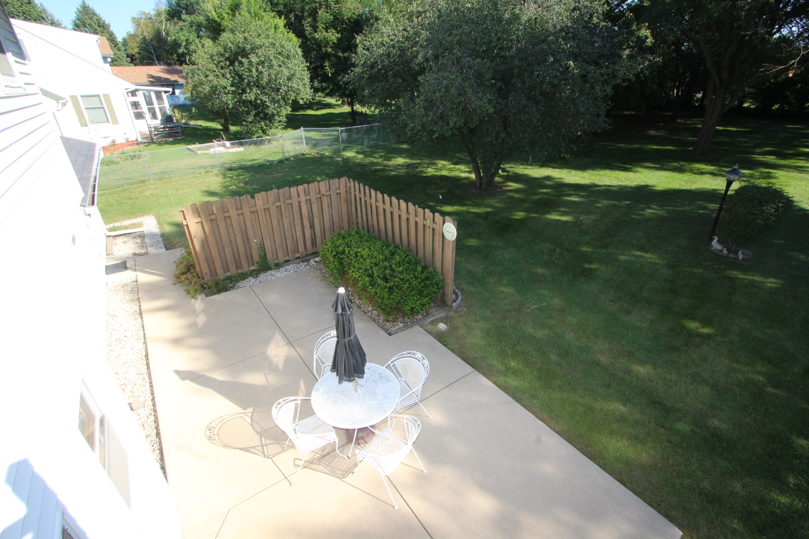 603 Old Orchard Road Harvard, IL 60033 - Photo 37 of 46 a view of a table and chairs in backyard