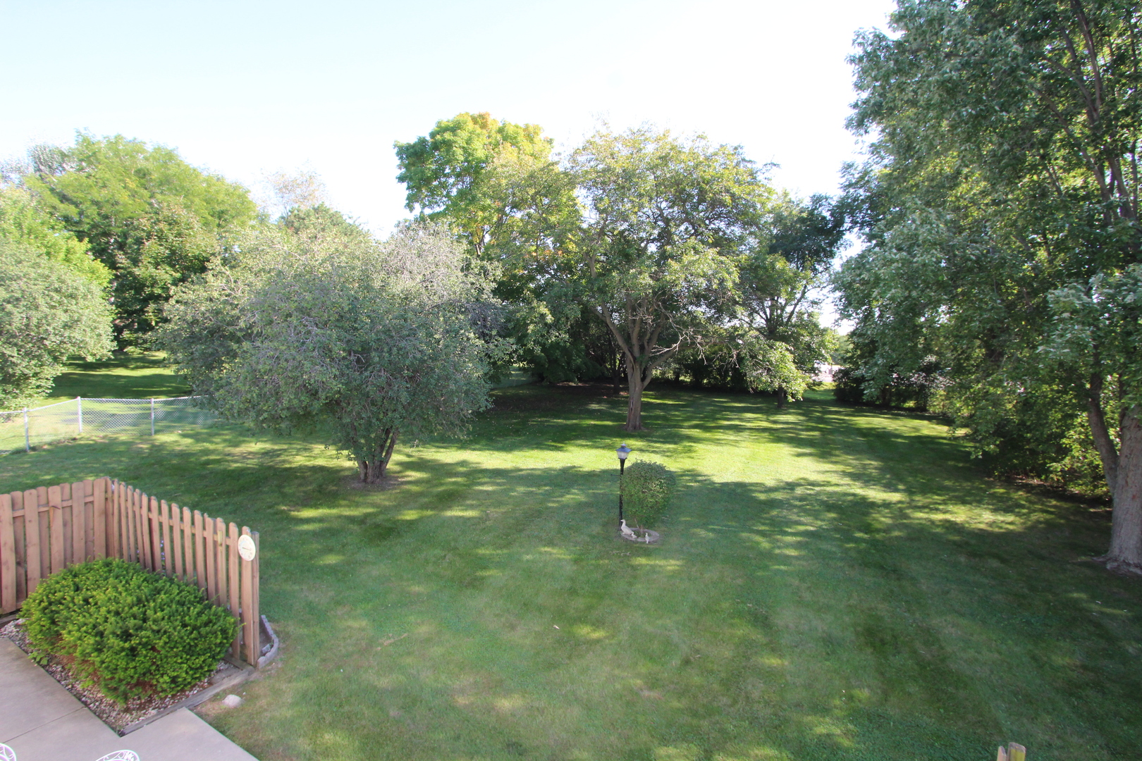 603 Old Orchard Road Harvard, IL 60033 - Photo 41 of 46 a swimming pool with wooden fence