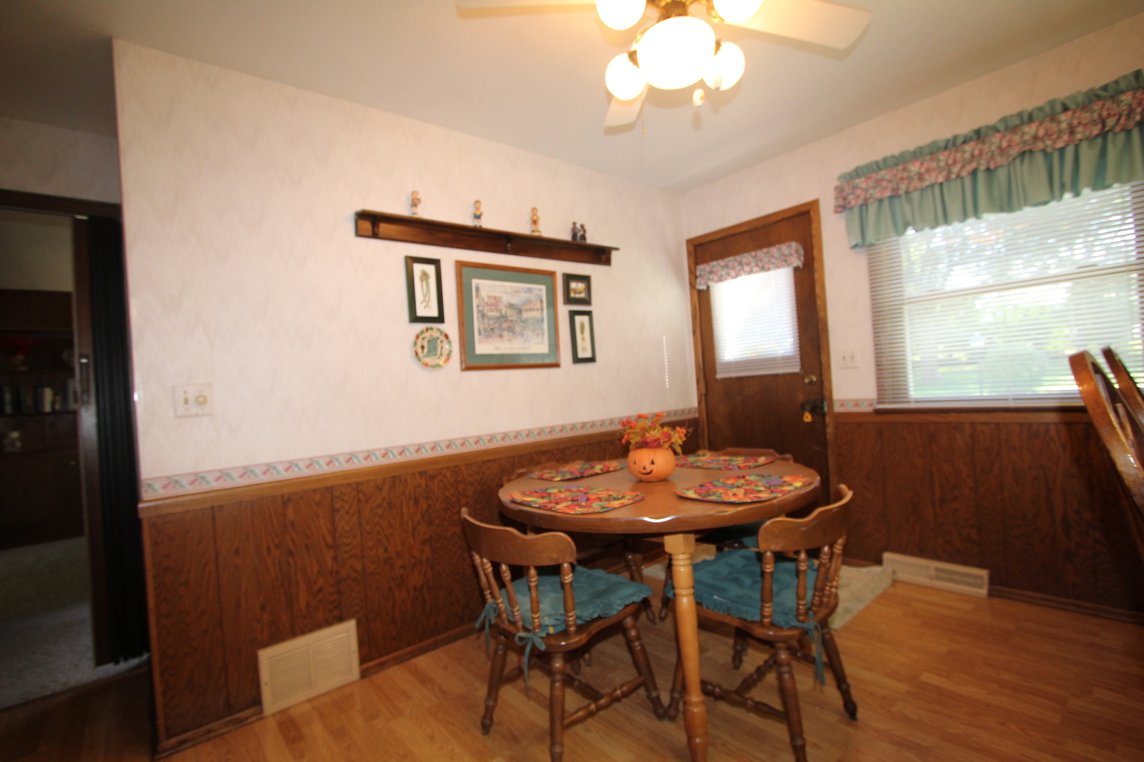 603 Old Orchard Road Harvard, IL 60033 - Photo 6 of 46 a view of a dining room with furniture and wooden floor