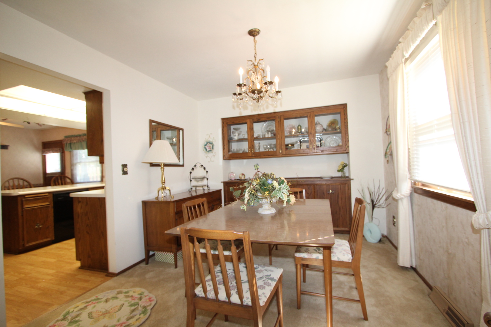 603 Old Orchard Road Harvard, IL 60033 - Photo 8 of 46 a view of a dining room with furniture and chandelier