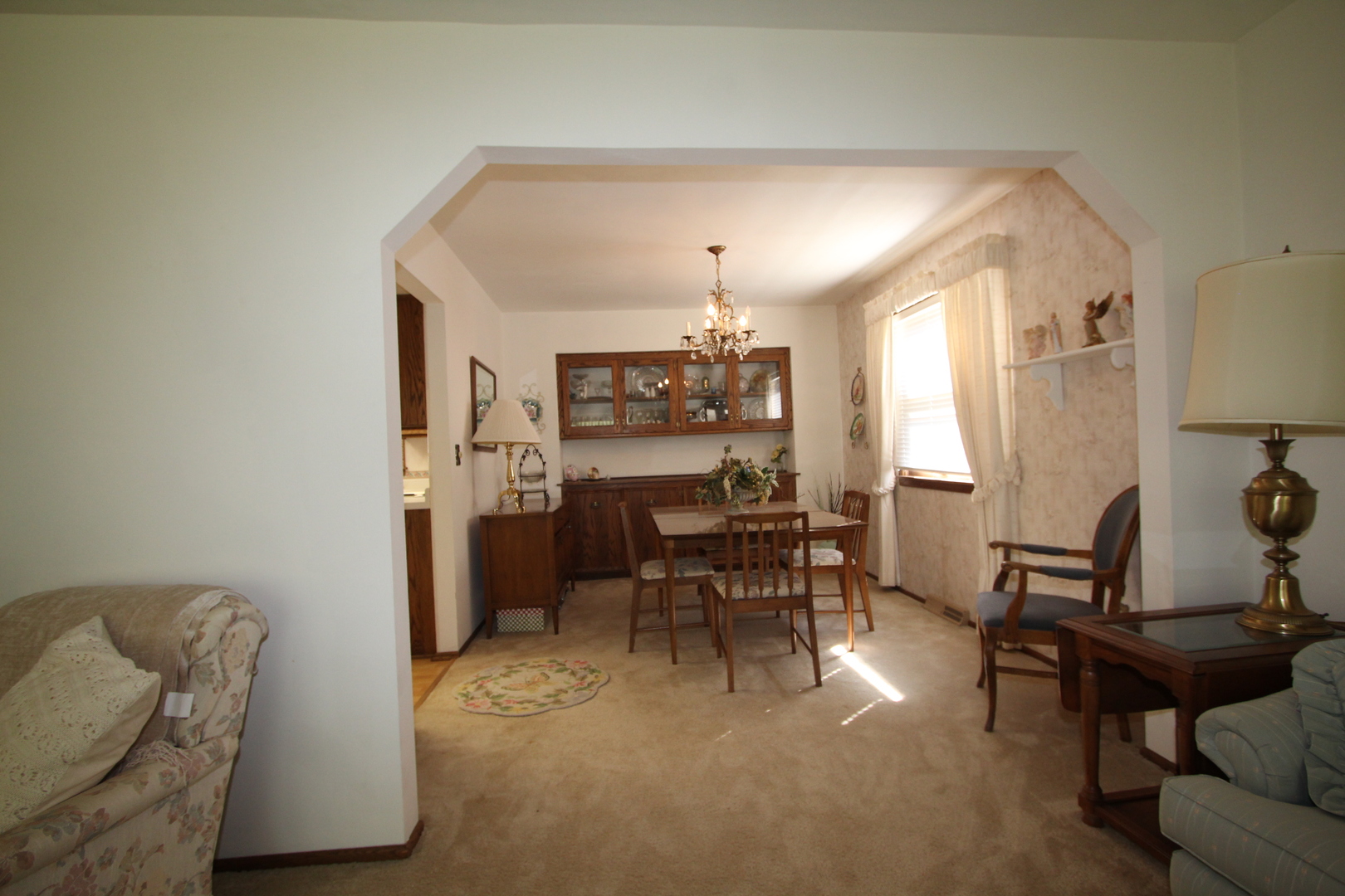 603 Old Orchard Road Harvard, IL 60033 - Photo 10 of 46 a living room with furniture and a chandelier