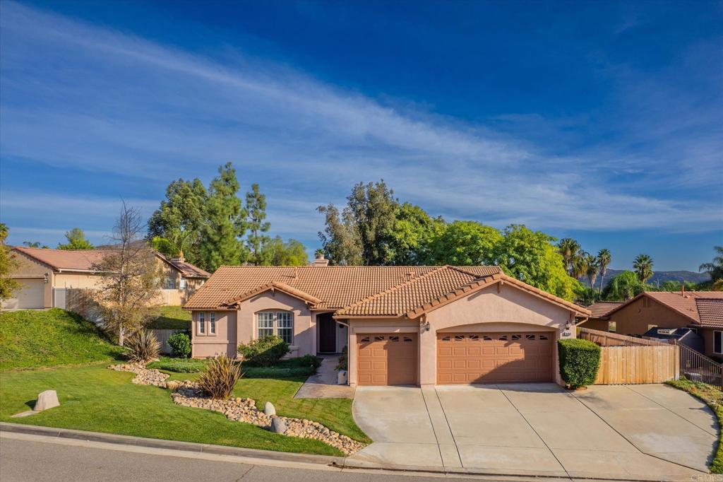 16350 Open View Road Ramona, CA 92065 - Photo 1 of 45 a front view of a house with a garden