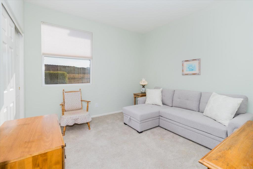 16350 Open View Road Ramona, CA 92065 - Photo 17 of 45 a living room with furniture and a couch