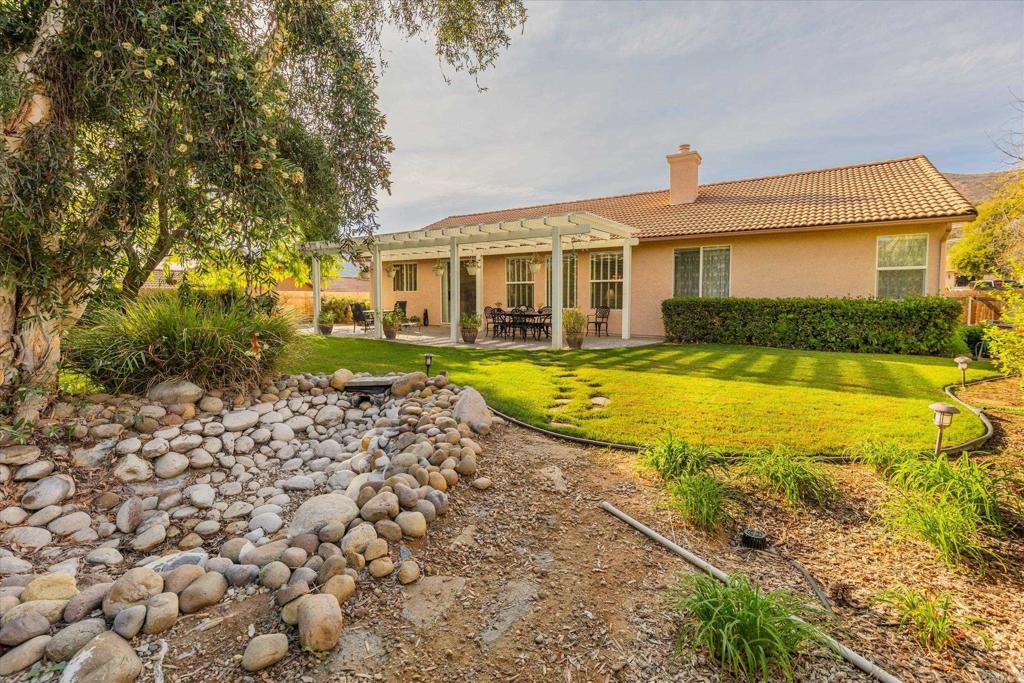 16350 Open View Road Ramona, CA 92065 - Photo 23 of 45 a front view of a house with swimming pool