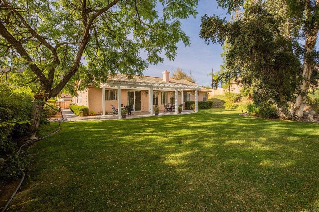 16350 Open View Road Ramona, CA 92065 - Photo 24 of 45 a front view of a house with a garden